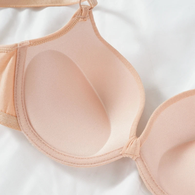 Nude-colored bra on a white background