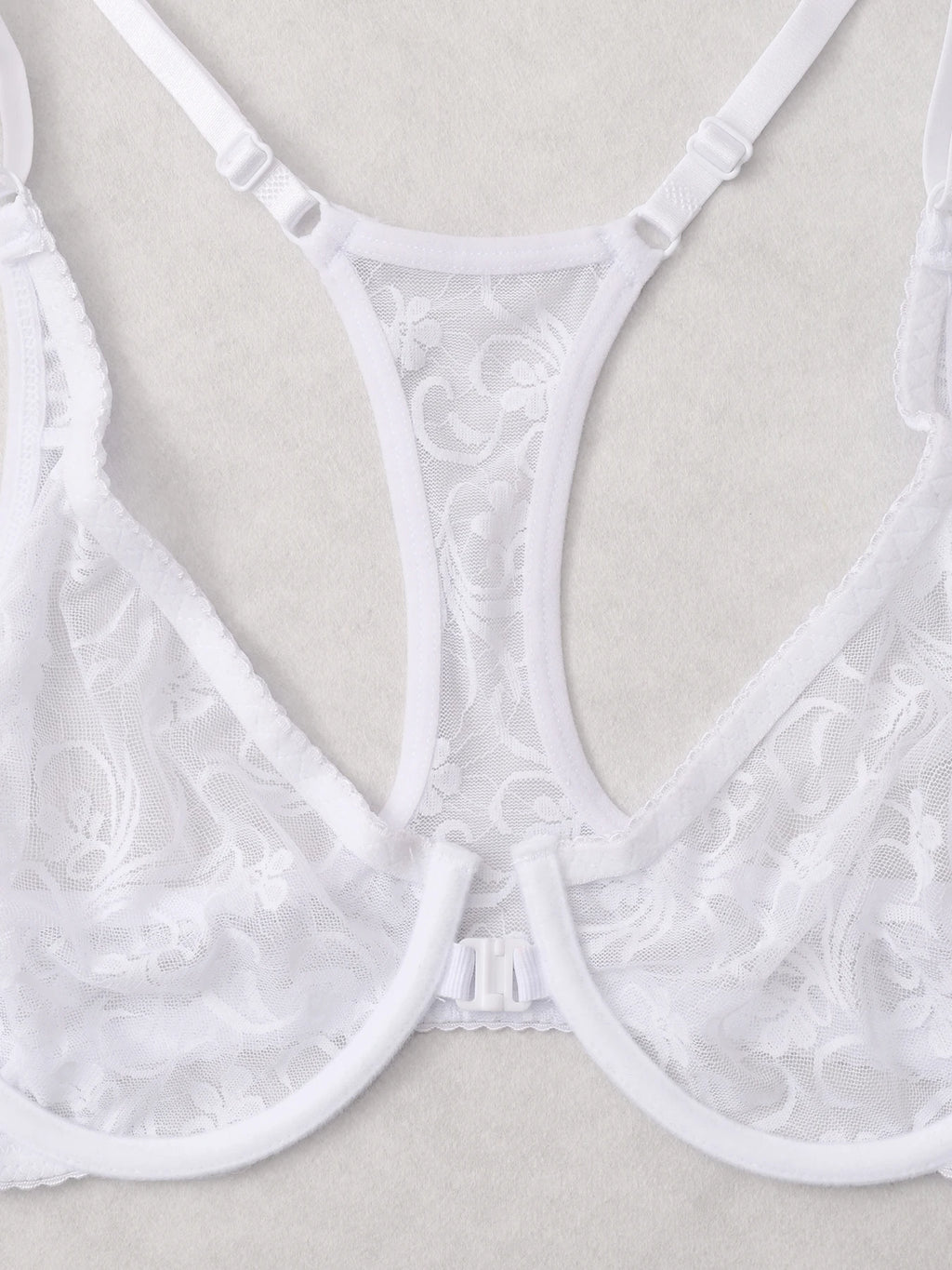 White lace bra on a beige background