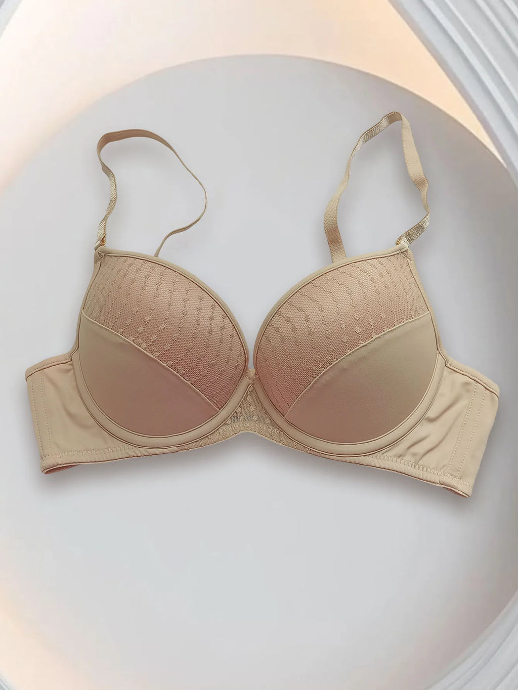 Beige bra on a light gray background