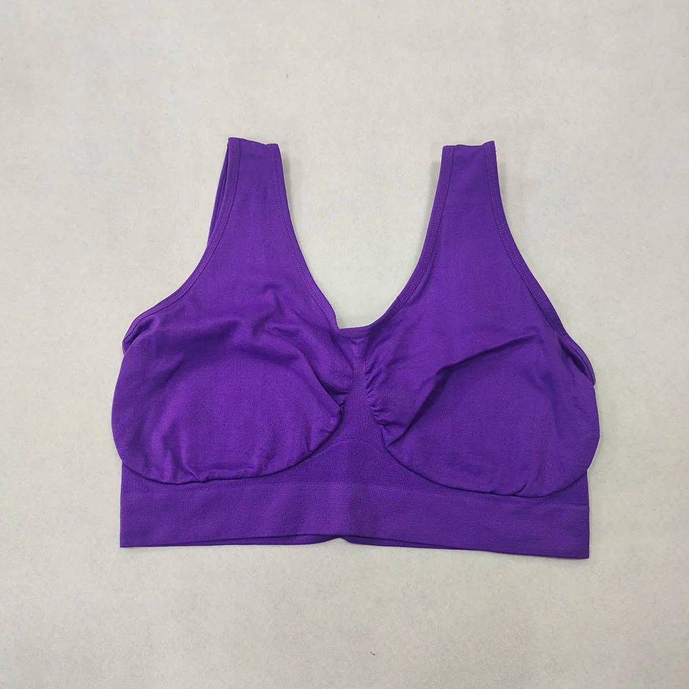 Purple sports bra on a light gray background