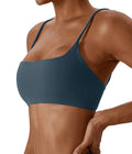 Blue sports bra worn by a person on a white background
