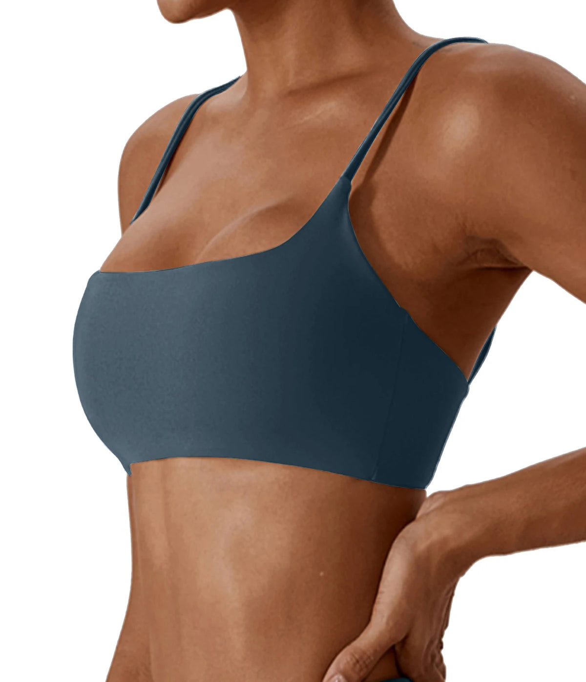 Blue sports bra worn by a person on a white background