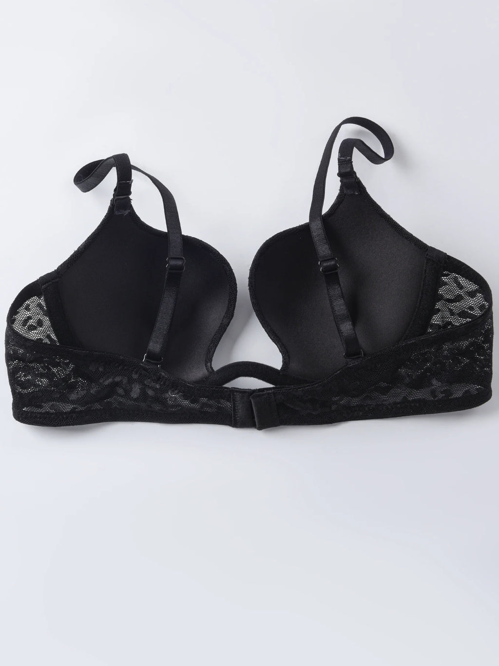 Black lace and satin underwire bra with adjustable shoulder straps and a center back strap, shown flat on a light gray background.