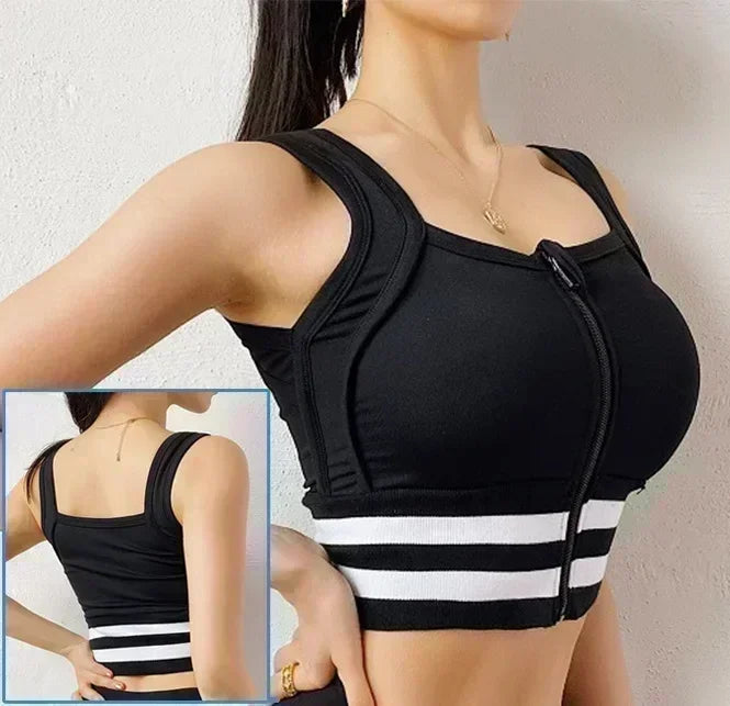 Black compression garment with white stripes worn by a model against a neutral background