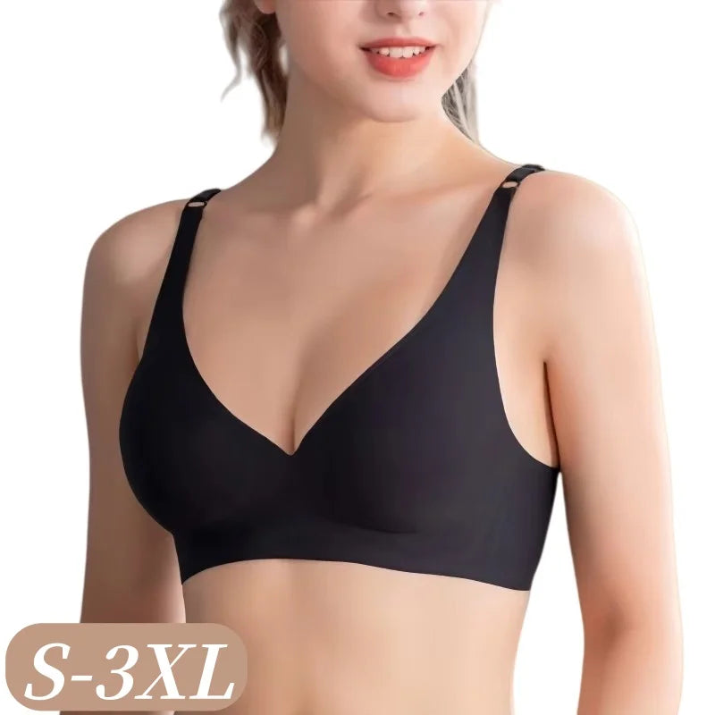 A woman wearing a black wireless bralette with wide shoulder straps and a deep V-neckline, shown from the chest up against a plain white background. A size label reading 'S-3XL' appears in the bottom-left corner.
