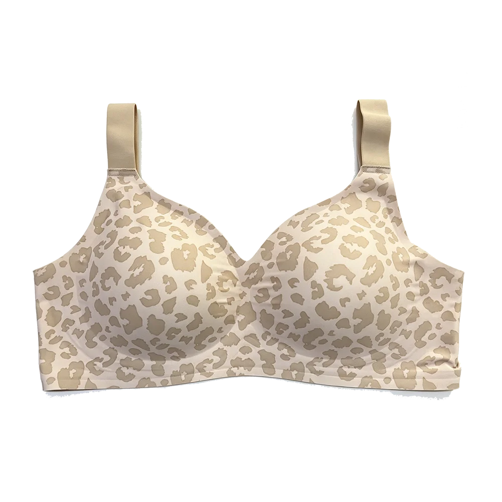 A wireless underwire bra with a beige and cream leopard print pattern, featuring adjustable shoulder straps, shown against a plain white background.