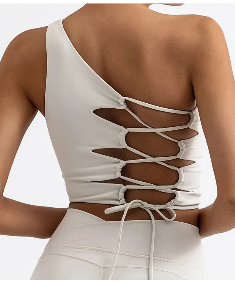 White lace-up top worn by a model on a white background