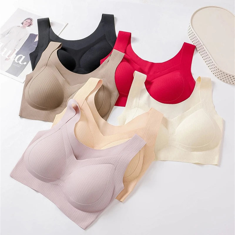 Set of women's bras in various colors on a white background