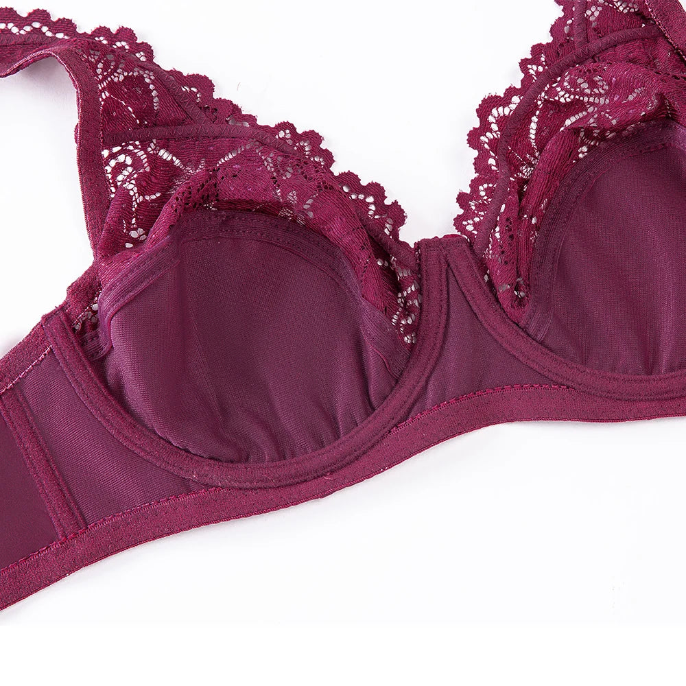 Maroon bra with lace detailing on a white background