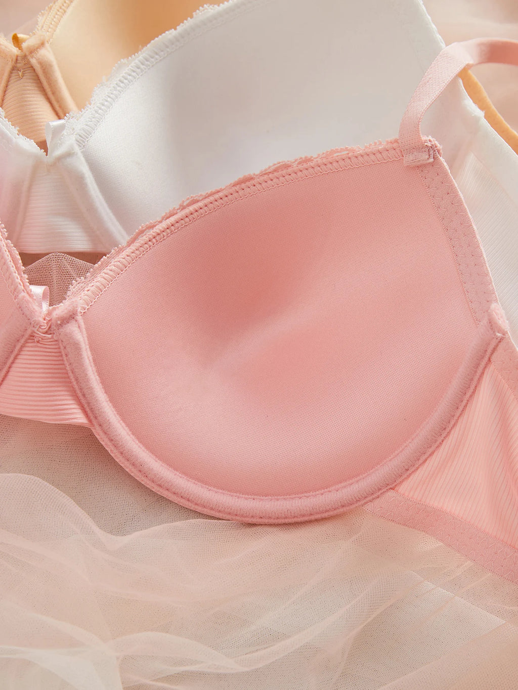 Pink bra on a soft pink background