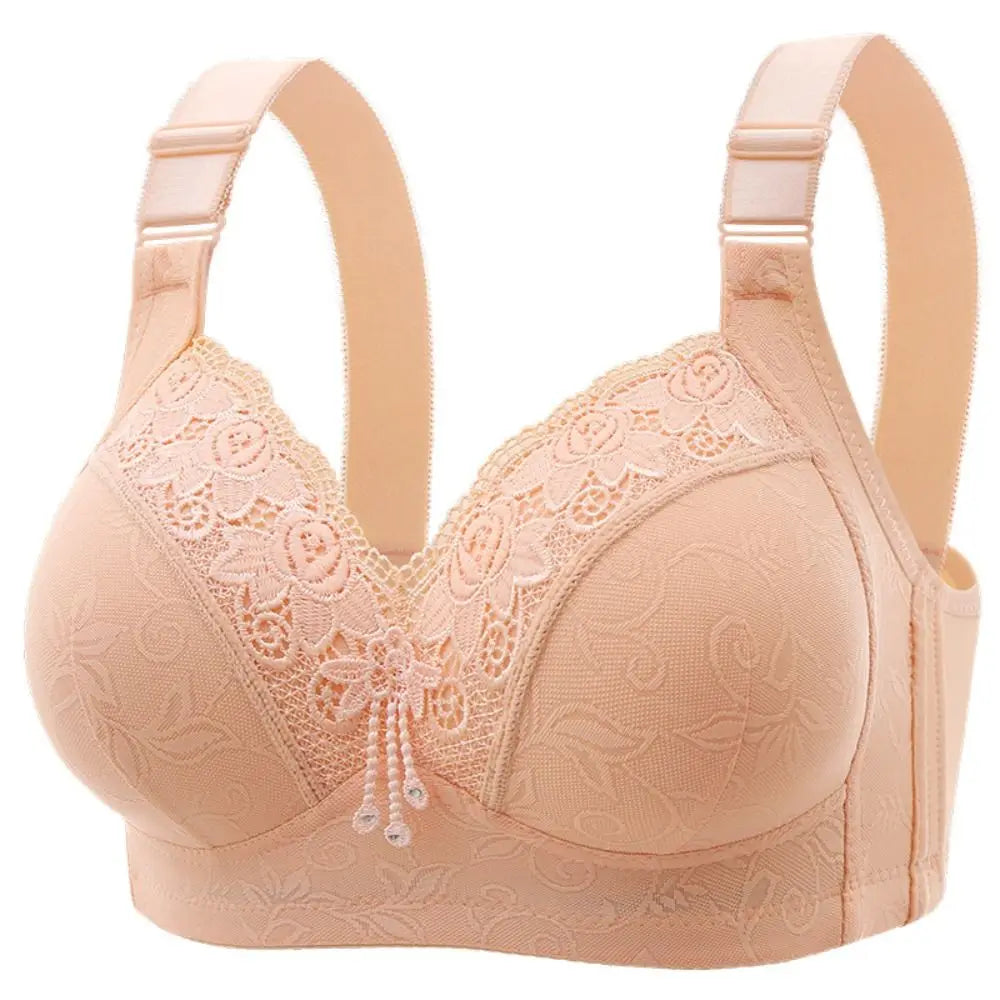 Beige bra with lace detailing on a white background