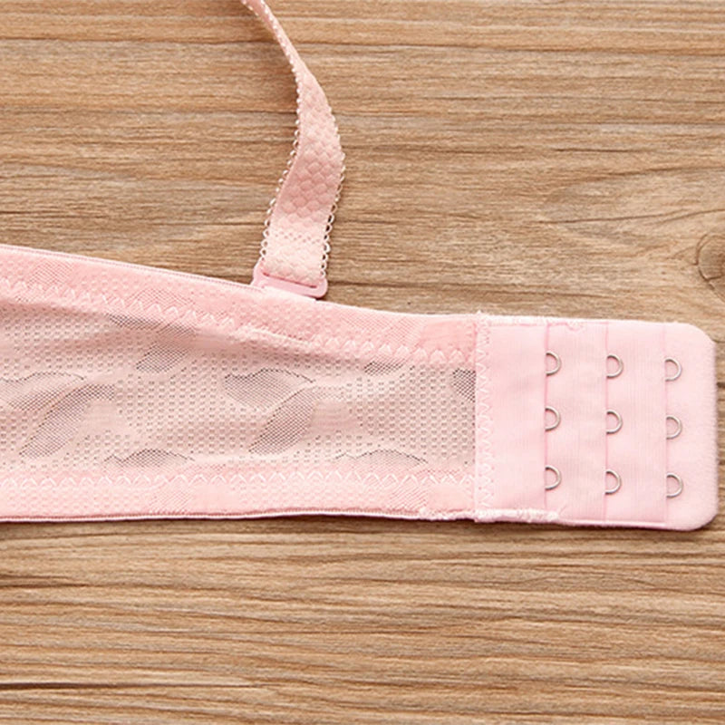 Pink bra strap on a wooden surface