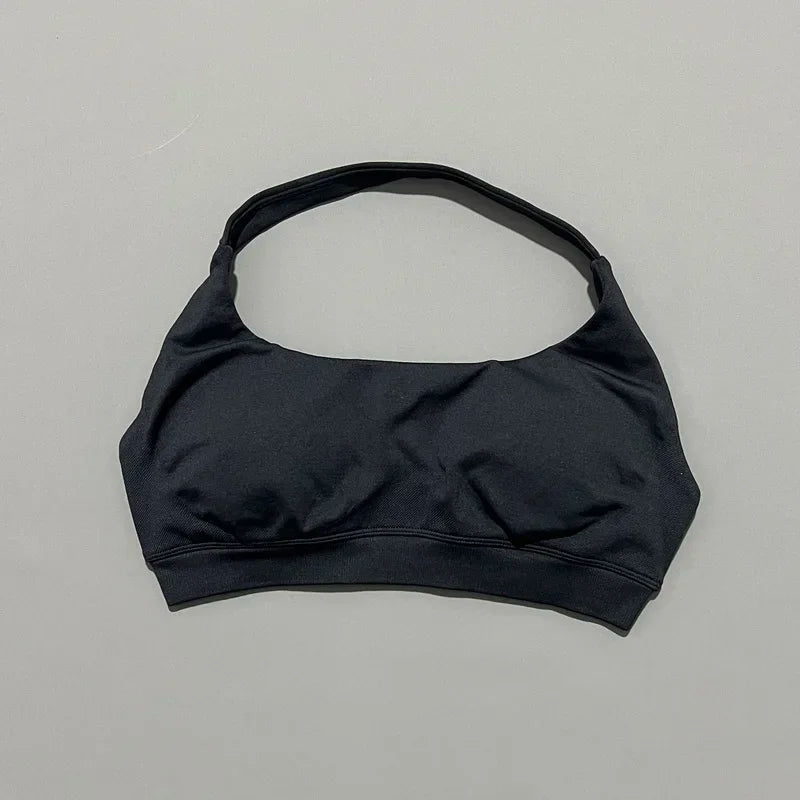 Black bikini top on a gray background