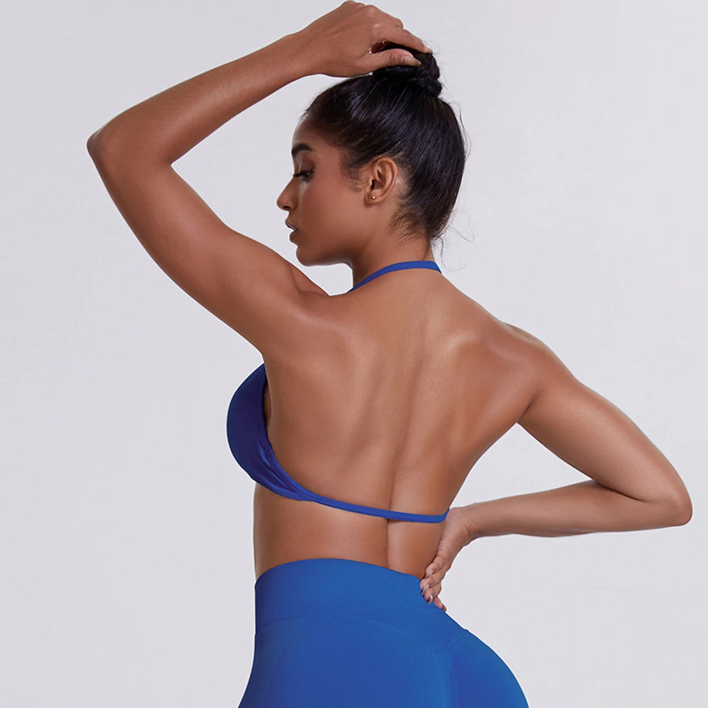 Woman wearing a blue bikini against a white background