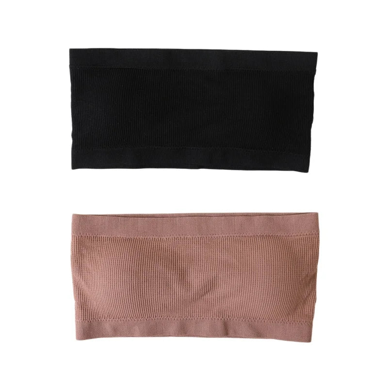 Two ribbed fabric headbands shown flat on a white background, one in solid black and the other in dusty rose pink.