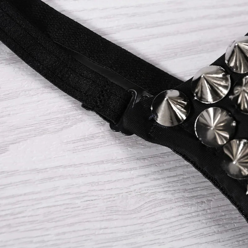 Black belt with silver studs on a light gray background