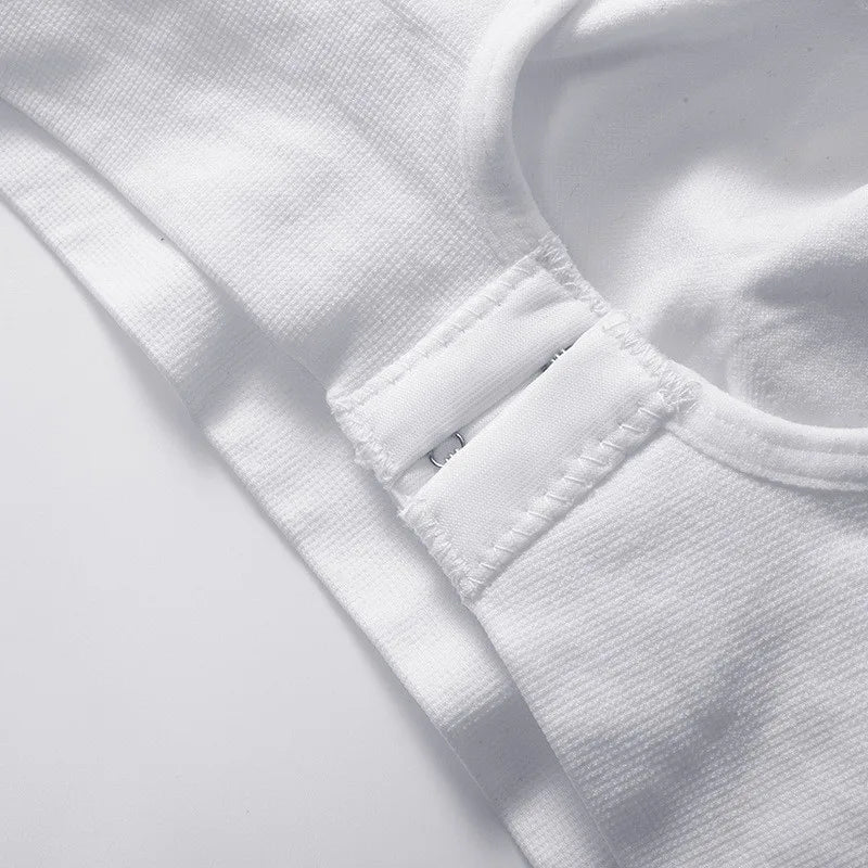Close-up of a white fabric with a button on a light gray background