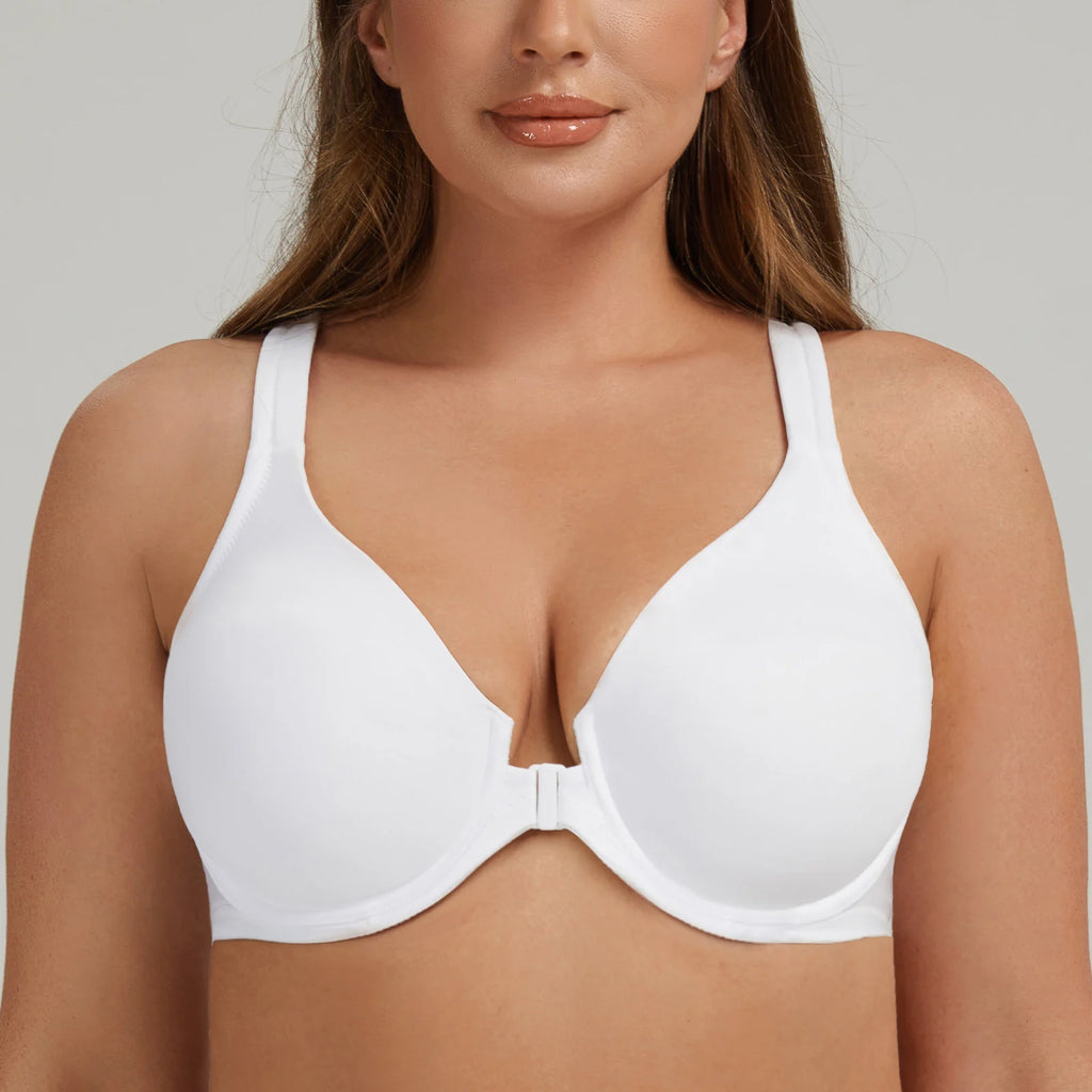 Woman wearing a white bra against a neutral background