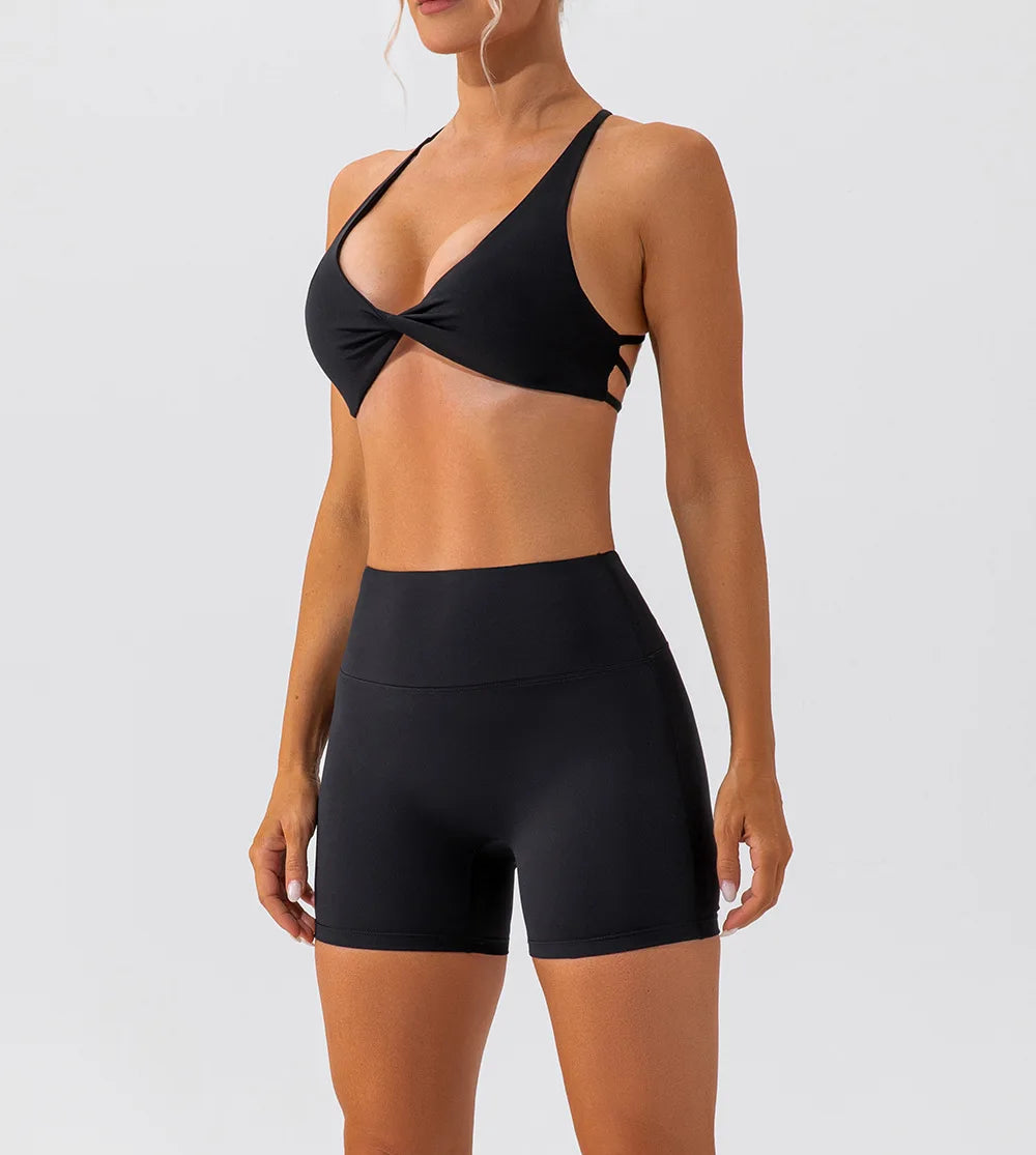 Black bikini set on a model against a white background