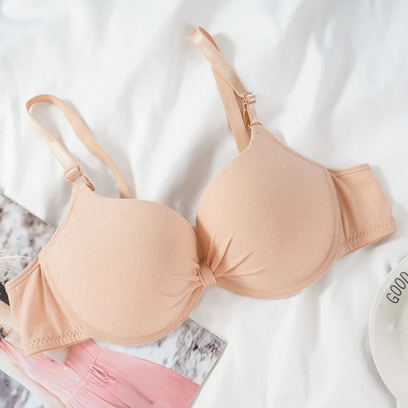 Beige bra on a white background