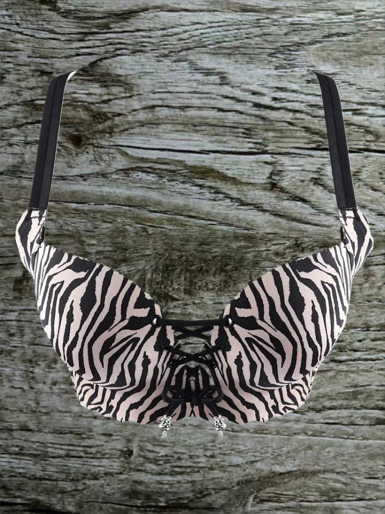 Zebra print bikini top on a wooden surface