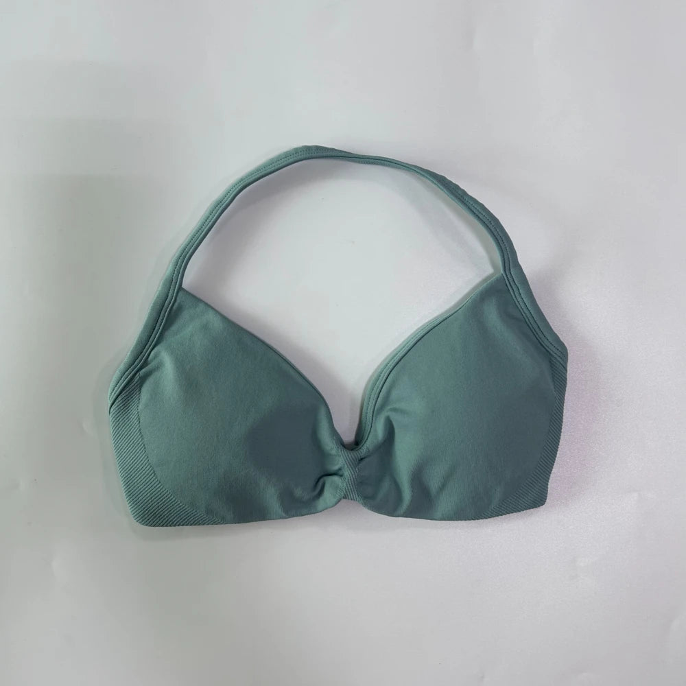 Green bikini top on a white background