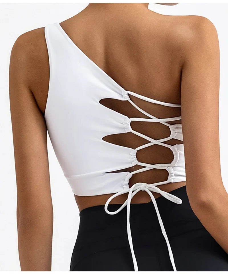 White crop top with lace-up back design on a white background