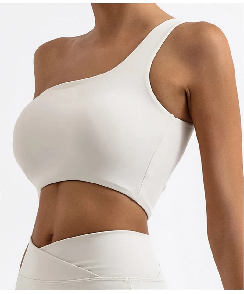 White sports bra worn by a person on a white background