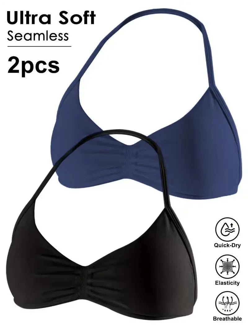 Two bikini cups on a white background, one in navy blue and one in black, with text reading 'Ultra Soft Seamless 2pcs' and small feature icons for Quick-Dry, Elasticity, and Breathable.