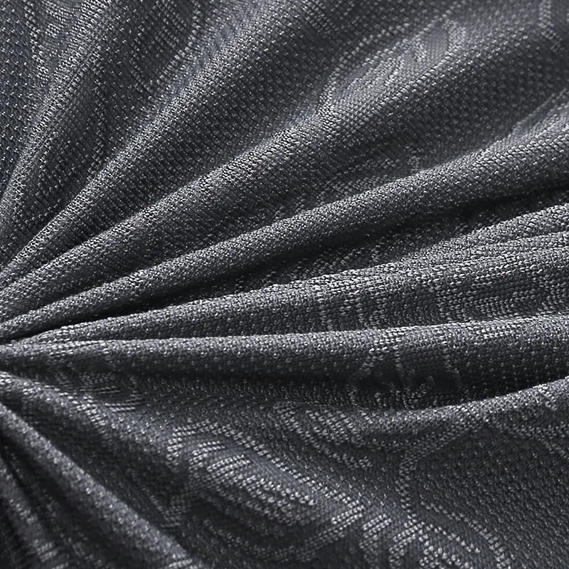 Close-up of textured black fabric with a subtle pattern