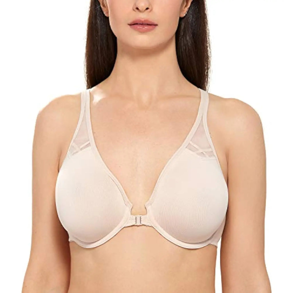 Woman wearing a beige bra on a white background