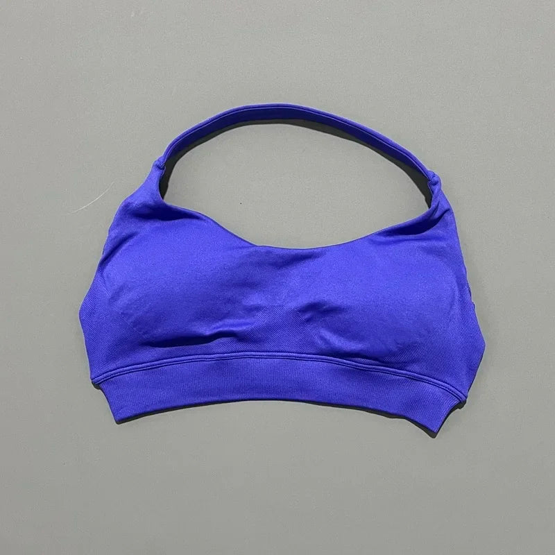 Blue sports bra on a gray background
