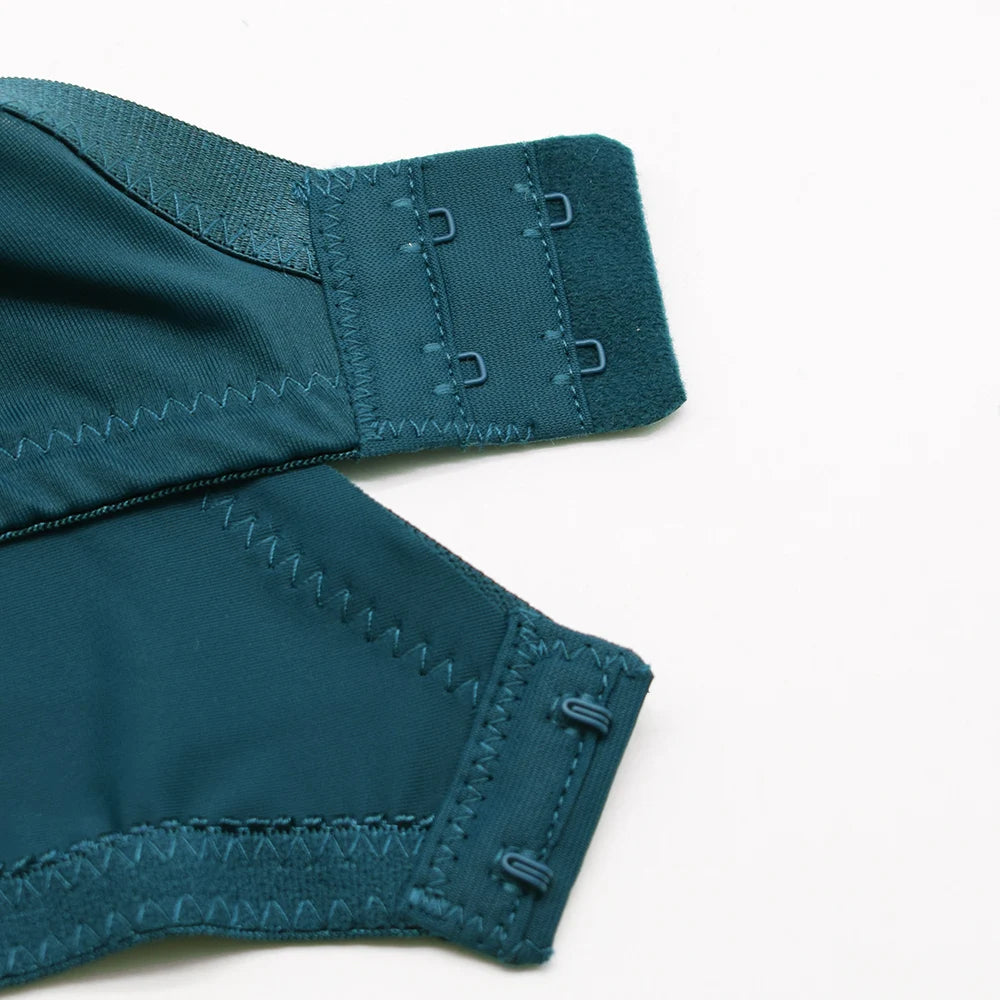 Teal fabric with stitching details on a white background