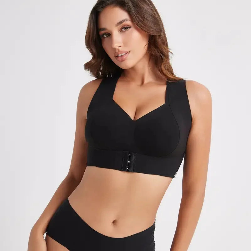 Woman wearing a black bra and underwear set on a white background