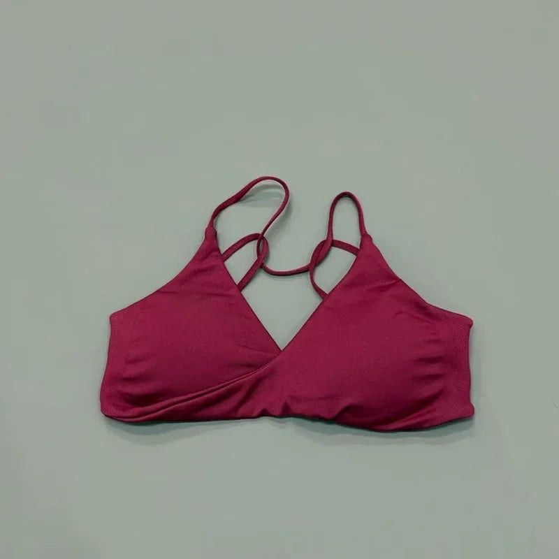 Pink bikini top on a light gray background