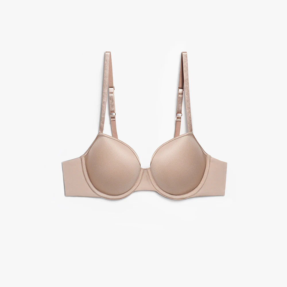 A seamless wireless underwire bra in a light nude beige color, shown flat against a clean white background.